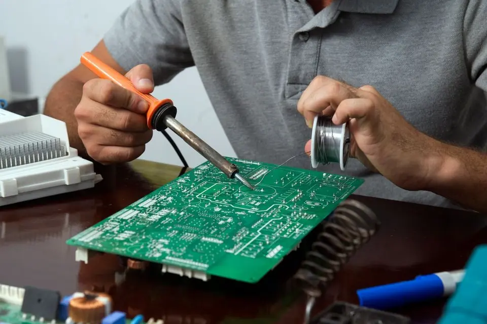 Man Working on a Circuit Board
